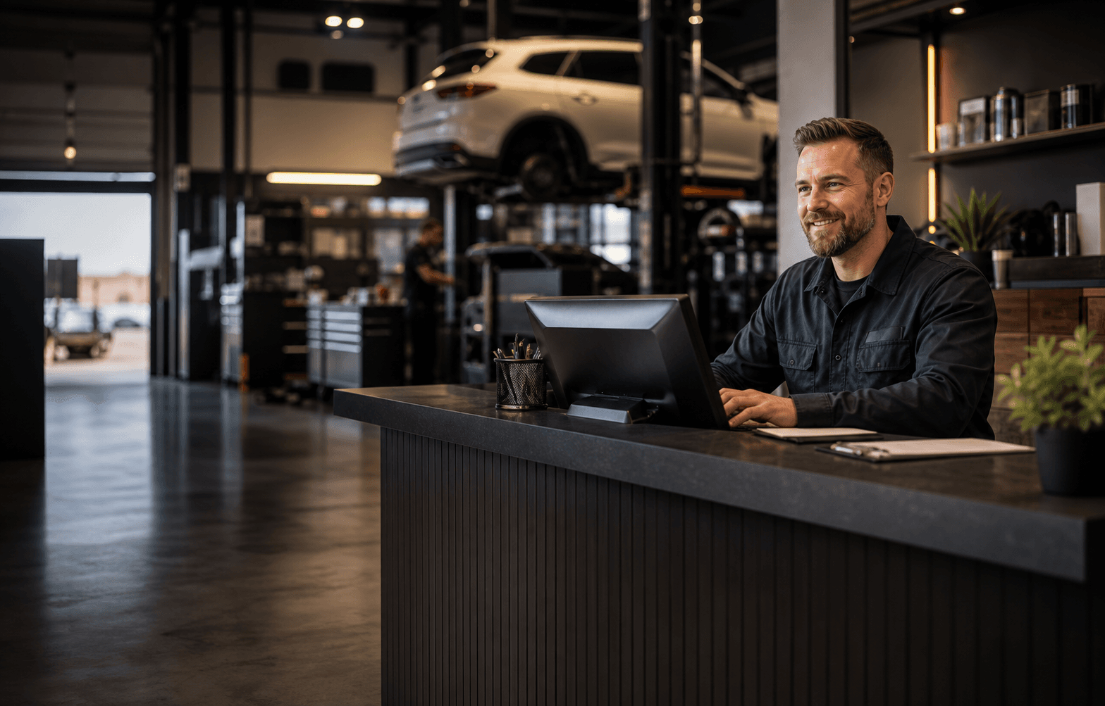 Auto repair service desk with a vehicle in the shop bay
